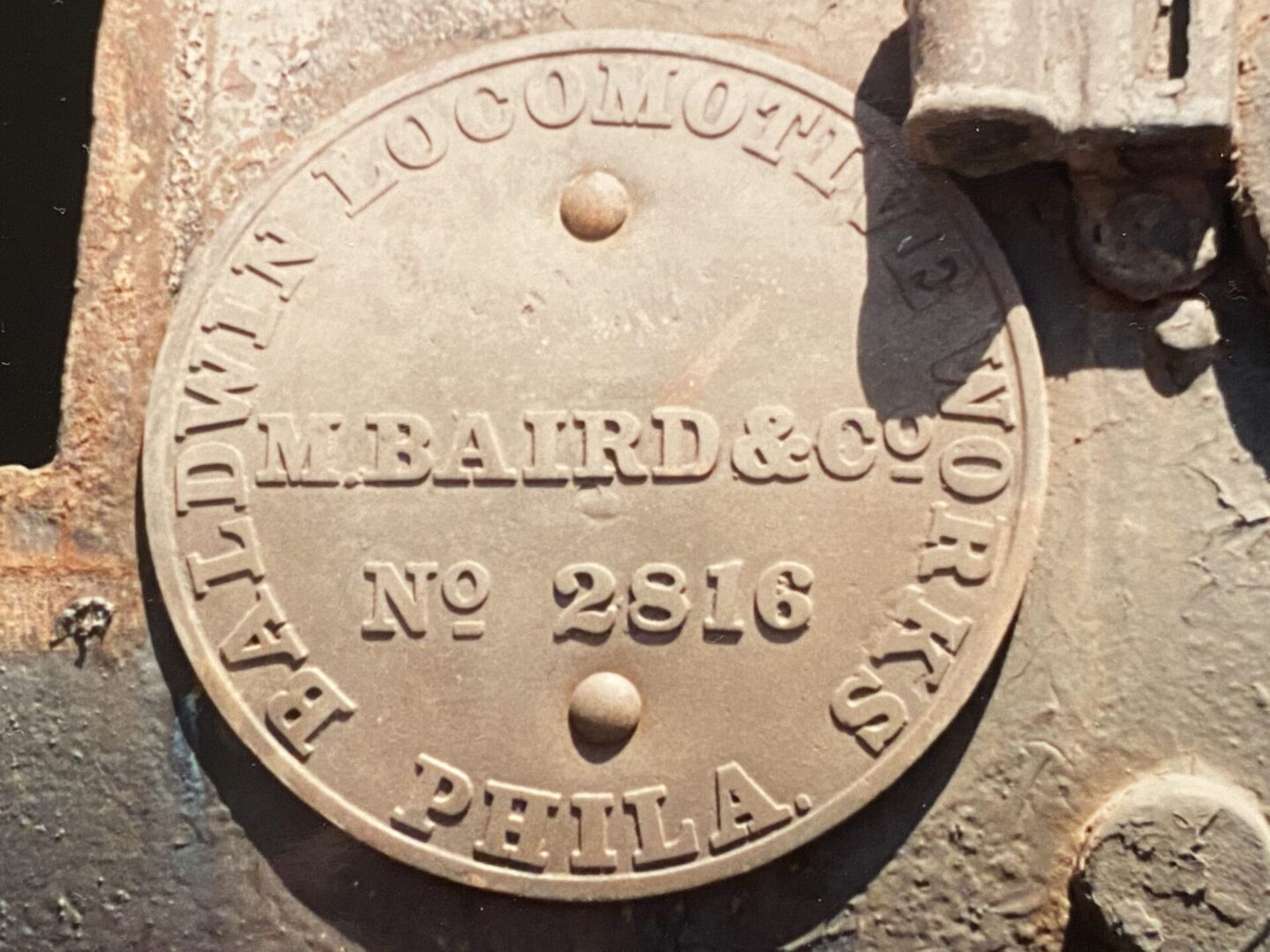 A close up of the top of an old steam engine.