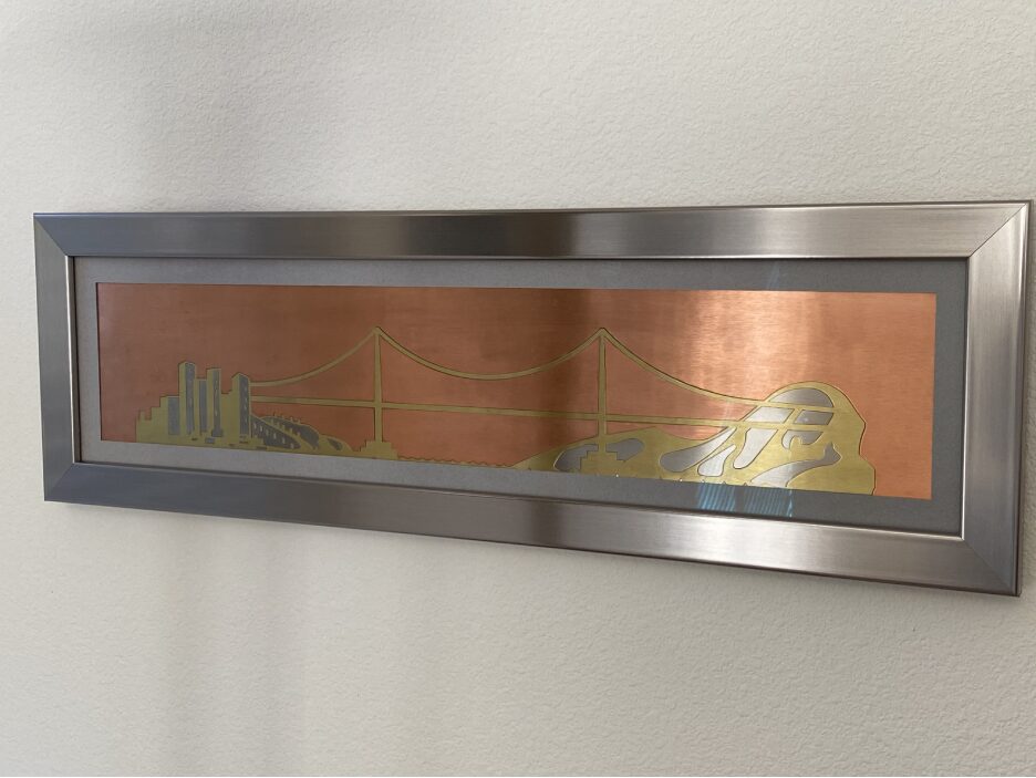 A metal frame with a picture on the wall.