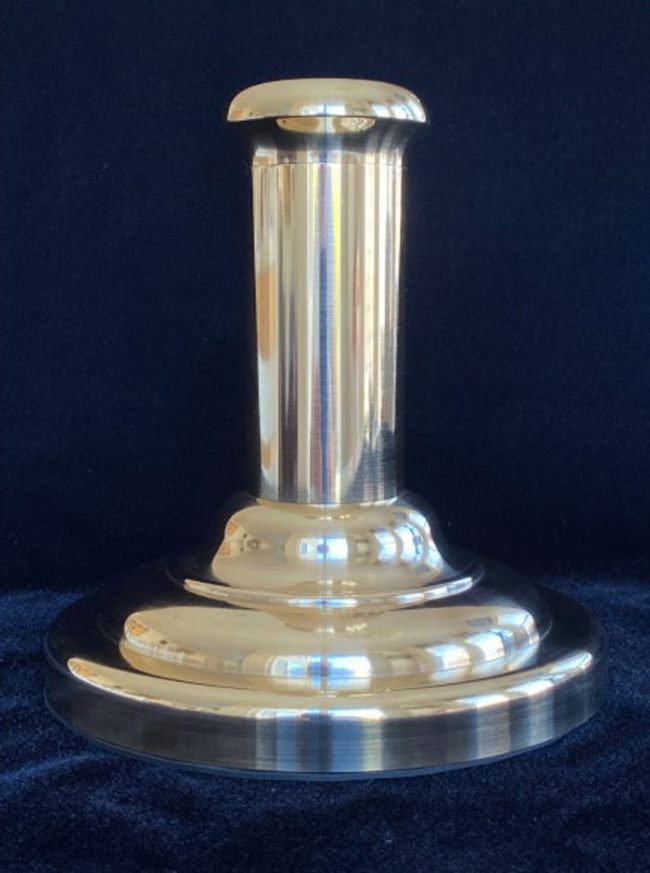 A silver candle holder with a blue background